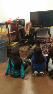 Reading to children while their parents are touring the facility